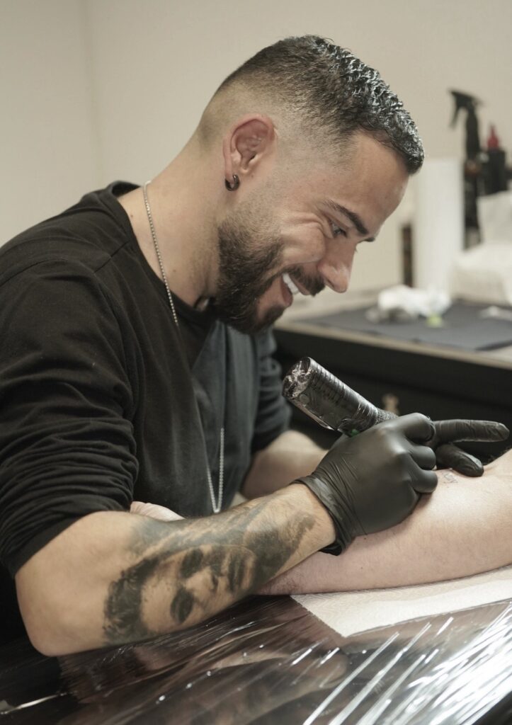 Professional portrait of tattoo artist Andre from Be Inkspired studio.